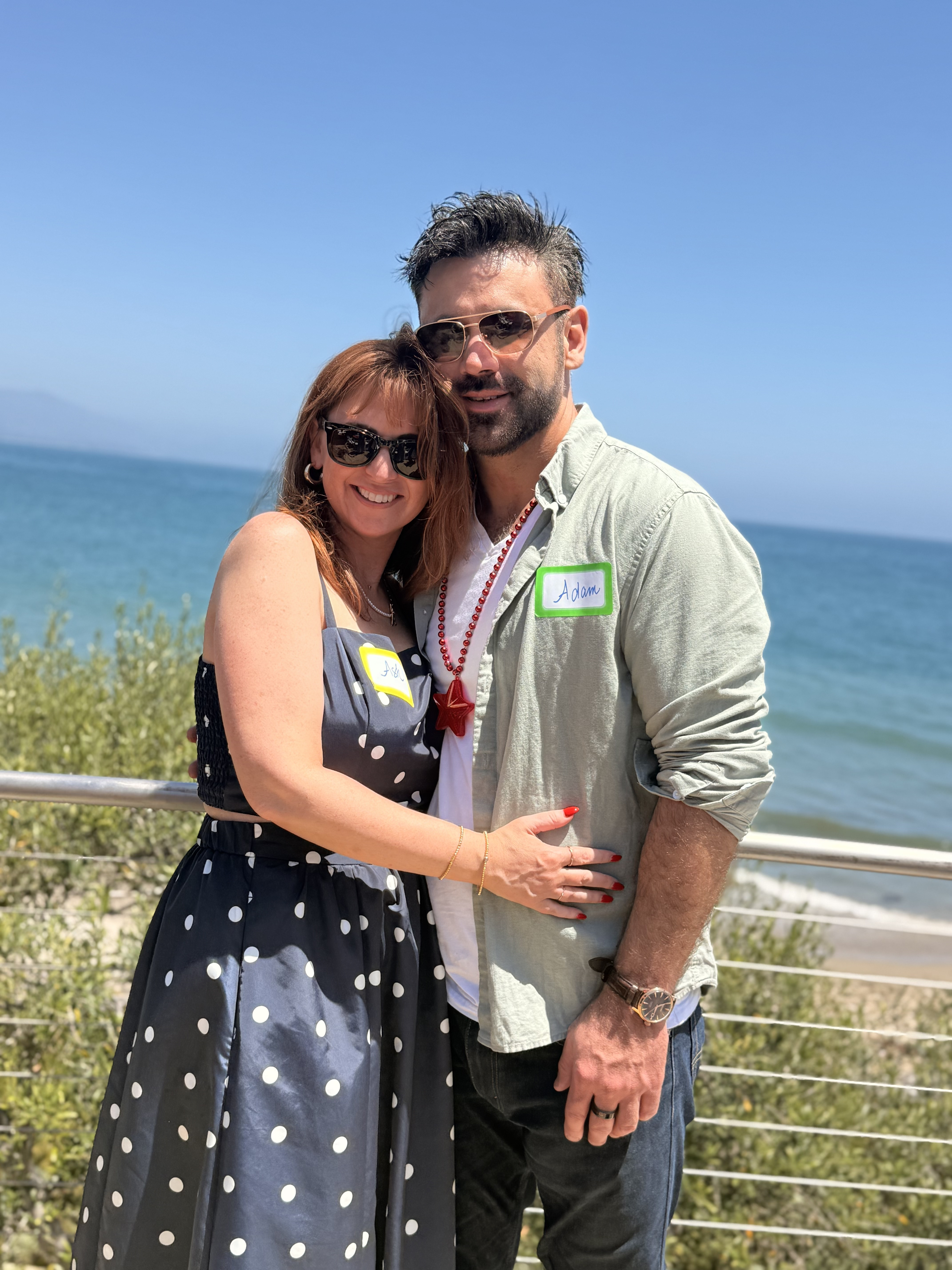 Ashlee and Adam on a bluff above the Pacific