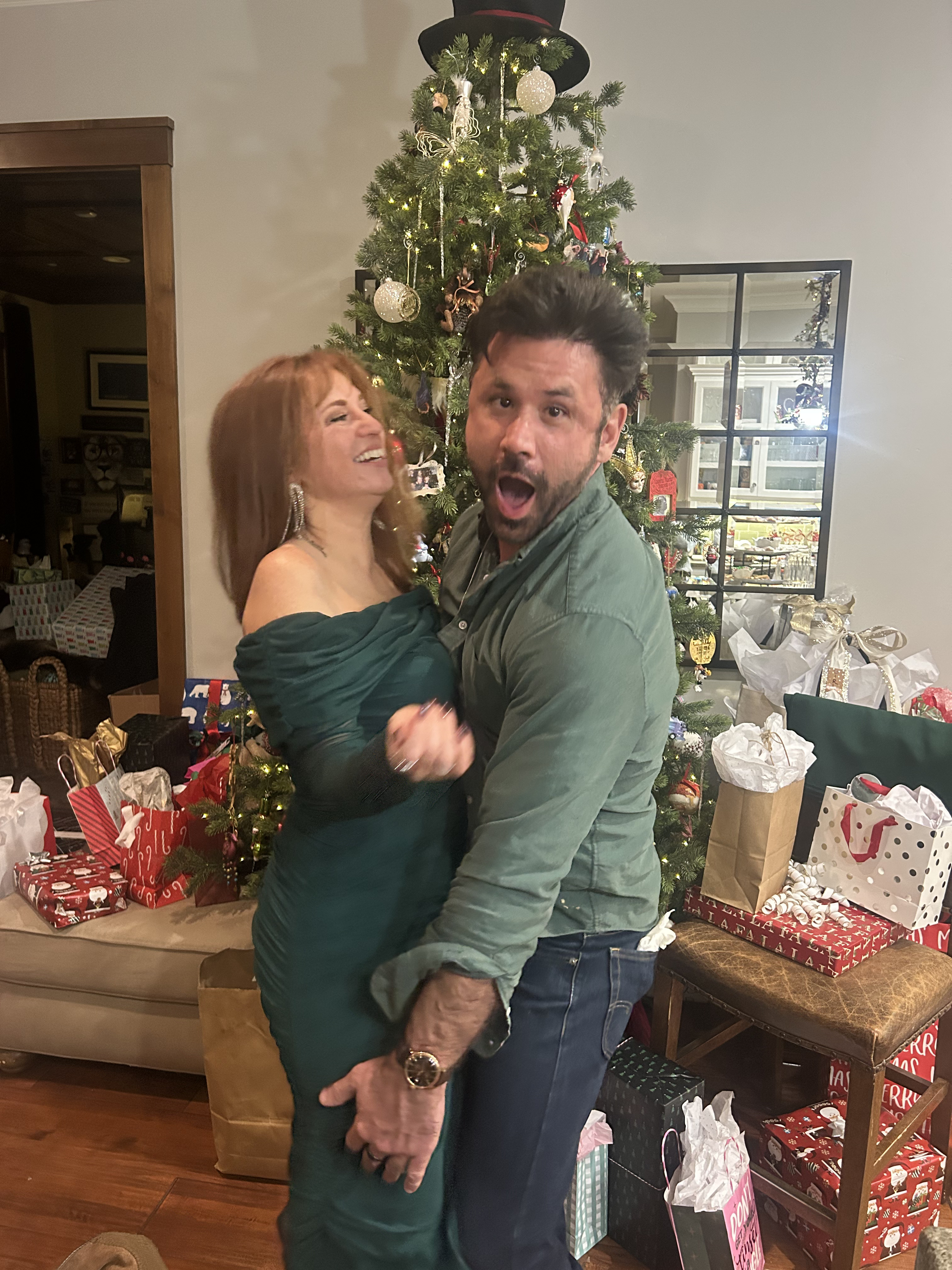 Both laughing mid-lift