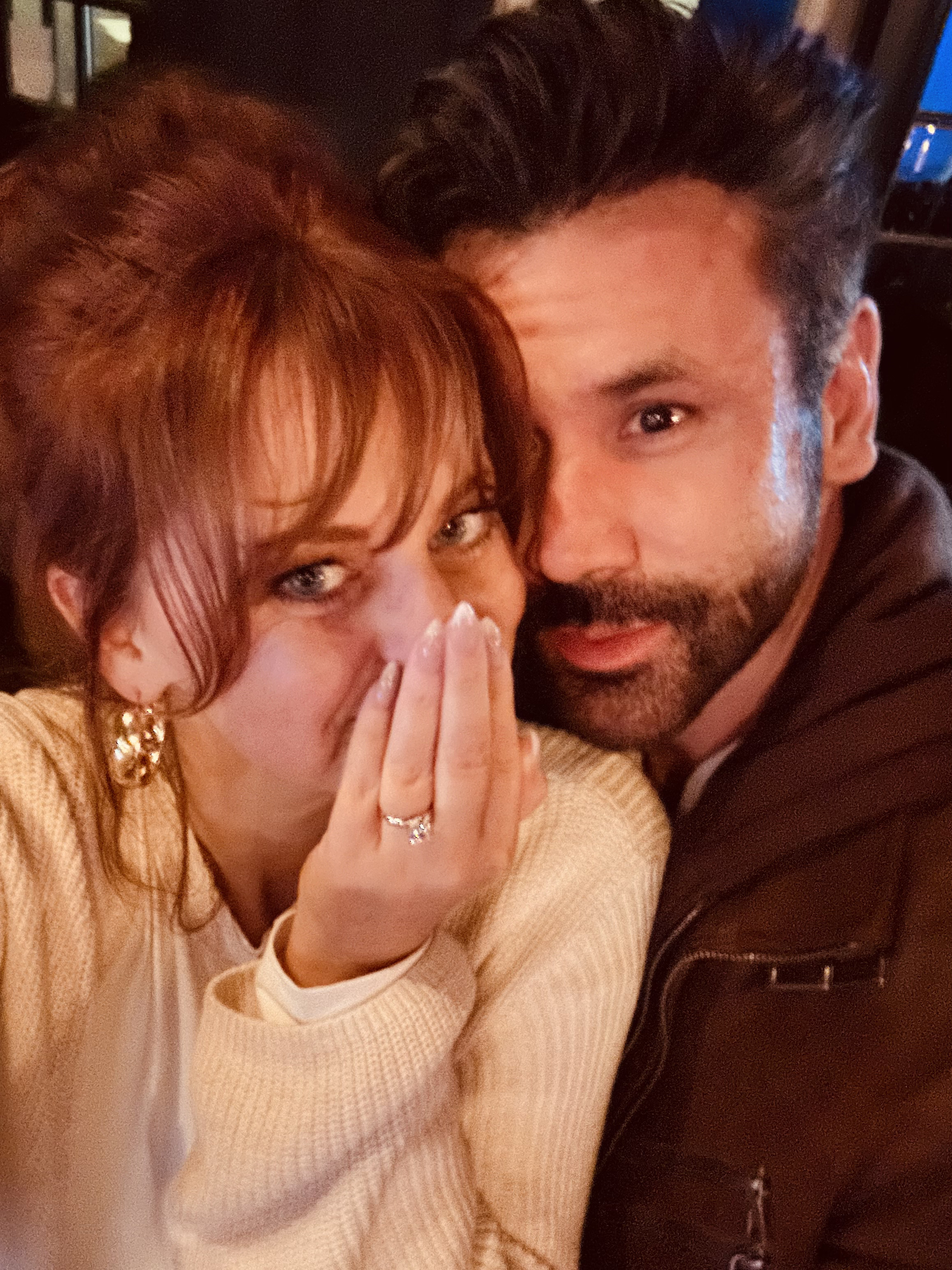 Ashlee showing the ring, happy tears, Adam cheek to cheek